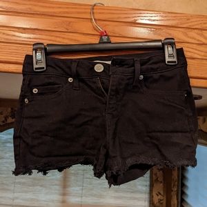 Destressed black jean shorts